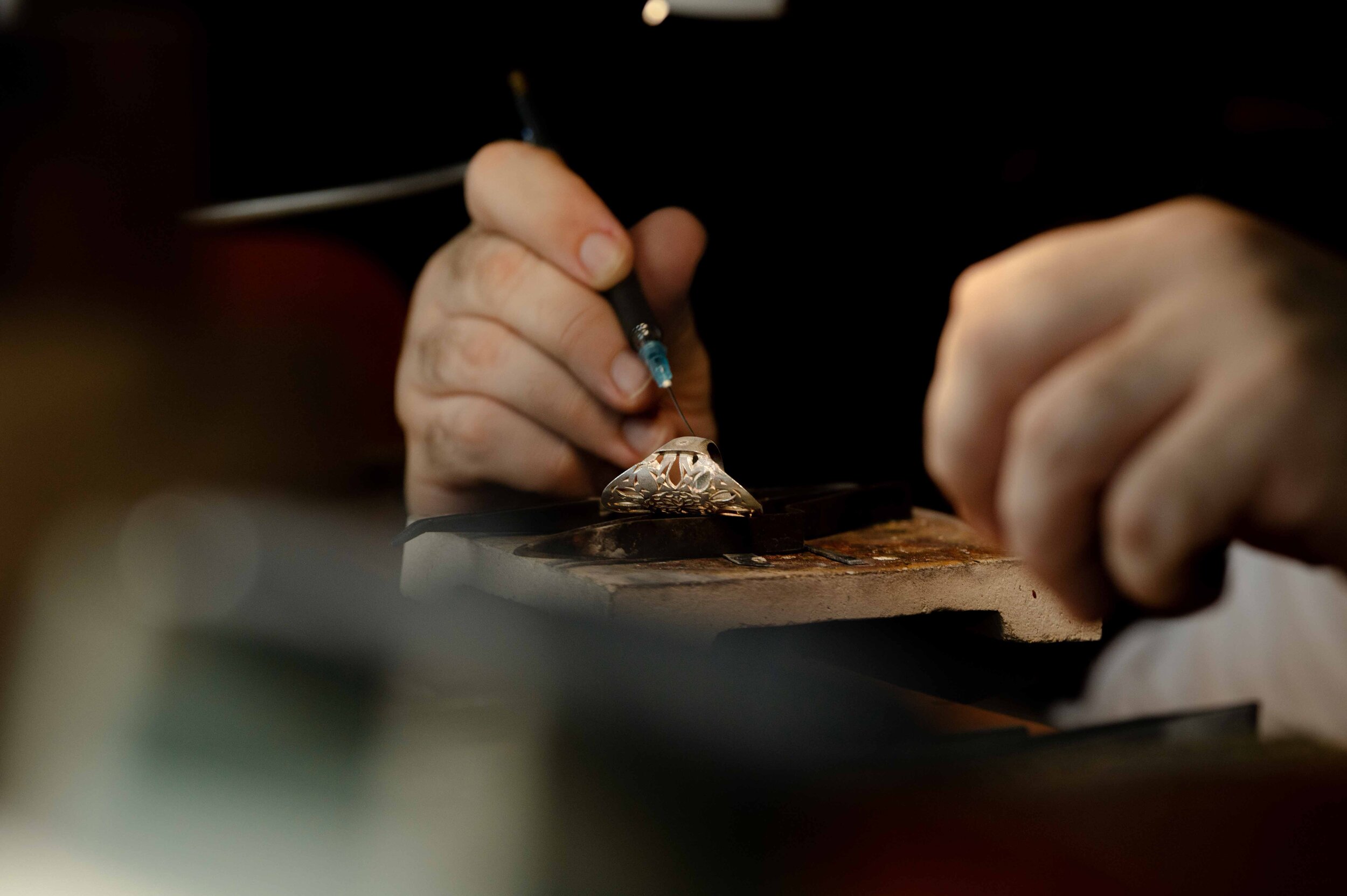 Close study of an artisan working with jewelry